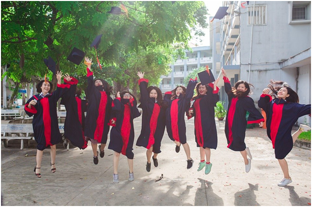 A group of friends jumping with joy on their graduation