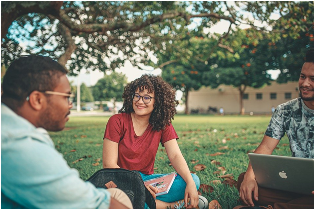 A group of students sitting a university garden
